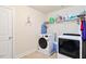 Laundry room with a washer and dryer, storage shelf, and plenty of space at 2207 Wimberly Woods Dr, Sanford, NC 27330