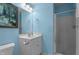 Cozy bathroom featuring a single sink vanity and step-in shower at 222 Sagamore Dr, Louisburg, NC 27549