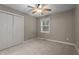 Neutral bedroom with carpet, ceiling fan, and double door closet at 222 Sagamore Dr, Louisburg, NC 27549