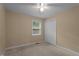 Neutral bedroom featuring a ceiling fan, double closet, and window at 222 Sagamore Dr, Louisburg, NC 27549