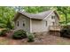 Exterior home view with wooden siding and a stone foundation accent at 222 Sagamore Dr, Louisburg, NC 27549