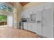 Bright kitchen with white cabinetry, stainless steel appliances, and view to the deck at 222 Sagamore Dr, Louisburg, NC 27549