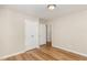 Bedroom with laminate flooring, neutral walls, and closet at 2312 Shannon St, Raleigh, NC 27610