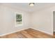 Bedroom with laminate flooring, natural light, and neutral paint at 2312 Shannon St, Raleigh, NC 27610