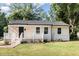 Charming single-story home with a well-maintained lawn and inviting front porch, displaying curb appeal at 2312 Shannon St, Raleigh, NC 27610