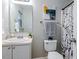 Well-lit bathroom with white cabinets, decorative painting, and a framed mirror at 2459 Bay Harbor Dr, Raleigh, NC 27604