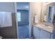Bathroom featuring a vanity with mirror, white cabinets, and a decorative towel rack at 2459 Bay Harbor Dr, Raleigh, NC 27604
