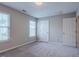 Neutral bedroom with natural light, carpeted floor and two large windows with blinds at 2459 Bay Harbor Dr, Raleigh, NC 27604