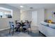Cozy dining area with modern furnishings with view into the kitchen and living room at 2459 Bay Harbor Dr, Raleigh, NC 27604