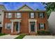 Brick two-story townhouse featuring classic architecture and well-maintained landscaping at 2459 Bay Harbor Dr, Raleigh, NC 27604