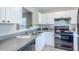 Bright kitchen features white cabinets, stainless steel appliances, and sleek countertops at 2459 Bay Harbor Dr, Raleigh, NC 27604