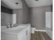 Bathroom features new vanity with stylish fixtures and flooring plus bathtub-shower combination at 249 Fisherman Point Rd, Roxboro, NC 27574