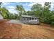 Charming home with gray siding, stone accents, and a welcoming red door at 249 Fisherman Point Rd, Roxboro, NC 27574