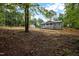 Charming home with a covered porch and stone accents surrounded by natural landscaping at 249 Fisherman Point Rd, Roxboro, NC 27574