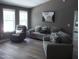Comfortable living room featuring lots of natural light and cozy seating at 249 Fisherman Point Rd, Roxboro, NC 27574