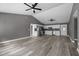Open-concept layout with modern flooring, stainless kitchen appliances, and vaulted ceilings offers easy entertaining at 249 Fisherman Point Rd, Roxboro, NC 27574
