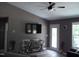 Living room features a wall-mounted TV, cozy furniture, and natural light at 249 Fisherman Point Rd, Roxboro, NC 27574