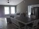 Open floor plan with living room and kitchen, featuring natural light and a neutral color palette at 249 Fisherman Point Rd, Roxboro, NC 27574