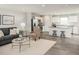 Inviting living room with modern furniture, open to the kitchen, and with lots of light at 260 Day Farm Dr, Lillington, NC 27546