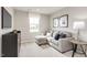 Cozy living room features a comfortable sectional sofa and a sleek entertainment center, perfect for relaxation at 260 Day Farm Dr, Lillington, NC 27546