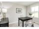Bright office space features a modern desk and chairs by a window, ideal for a productive work environment at 260 Day Farm Dr, Lillington, NC 27546