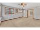 This basement has carpeted floors, painted wood walls, and two windows to let in light at 2600 Wade Ave, Raleigh, NC 27607