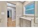 This bathroom has a marble vanity, and is adjacent to a walk-in closet and the main bedroom at 2600 Wade Ave, Raleigh, NC 27607