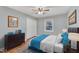Cozy bedroom featuring a ceiling fan, double closet, and a bright window view at 2600 Wade Ave, Raleigh, NC 27607