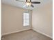 Bedroom features neutral walls and carpet, a ceiling fan, a window with natural light, and molding at 2835 Bedfordshire Ct, Raleigh, NC 27604