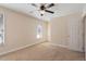 The spacious bedroom features carpeting and a ceiling fan at 2835 Bedfordshire Ct, Raleigh, NC 27604