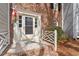 Inviting entrance with a white trimmed door, patterned sidelights, and brick steps at 2835 Bedfordshire Ct, Raleigh, NC 27604