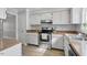 Well-maintained kitchen featuring white cabinets and stainless steel appliances at 2835 Bedfordshire Ct, Raleigh, NC 27604