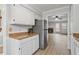 Bright kitchen featuring white cabinets, stainless steel appliances, and an open layout at 2835 Bedfordshire Ct, Raleigh, NC 27604