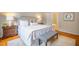 Well-lit bedroom featuring bedside tables, a window to the outside, and light neutral decor at 303 Laurens Way, Chapel Hill, NC 27516