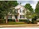 Charming two-story home with well-maintained landscaping, black shutters, and a welcoming entrance at 303 Laurens Way, Chapel Hill, NC 27516