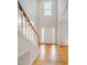 Bright foyer with gleaming hardwood floors and a grand staircase at 303 Laurens Way, Chapel Hill, NC 27516