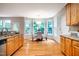 Bright kitchen featuring granite countertops, stainless steel appliances, and breakfast nook with natural light at 303 Laurens Way, Chapel Hill, NC 27516