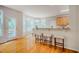 Bright kitchen offers stainless appliances, wooden cabinets, granite countertops, and breakfast bar at 303 Laurens Way, Chapel Hill, NC 27516