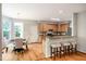 Kitchen showcases wood cabinets, granite counters, stainless steel appliances, and a breakfast bar at 303 Laurens Way, Chapel Hill, NC 27516