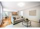 Spacious living room with hardwood floors and an open layout, perfect for entertaining guests at 303 Laurens Way, Chapel Hill, NC 27516