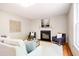 Bright living room featuring a fireplace, comfortable seating, and stylish decor at 303 Laurens Way, Chapel Hill, NC 27516