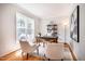 Charming study features a large window, hardwood flooring, and a calming color palette at 303 Laurens Way, Chapel Hill, NC 27516