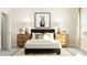 Well-lit bedroom featuring a decorative rug, stylish lamps, and a monochromatic horse print at 308 Canyon Spring Trl, Wake Forest, NC 27587