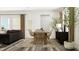 Open-concept dining area next to the living room, with stylish furniture at 308 Canyon Spring Trl, Wake Forest, NC 27587