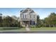 Charming two-story home featuring stone accents and a well-manicured lawn at 308 Canyon Spring Trl, Wake Forest, NC 27587