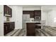Modern kitchen featuring stainless steel appliances and a granite island at 308 Canyon Spring Trl, Wake Forest, NC 27587
