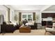 Beautiful living room with large windows, a comfortable sofa, and stylish decor at 308 Canyon Spring Trl, Wake Forest, NC 27587