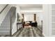 Inviting living room featuring modern finishes, staircase, and great natural light at 308 Canyon Spring Trl, Wake Forest, NC 27587