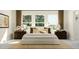 Cozy main bedroom with ambient lighting, neutral bedding, and great windows at 308 Canyon Spring Trl, Wake Forest, NC 27587