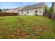 Lush backyard view showing the house's back exterior and the surrounding fence at 3108 Forrestal Dr, Durham, NC 27703